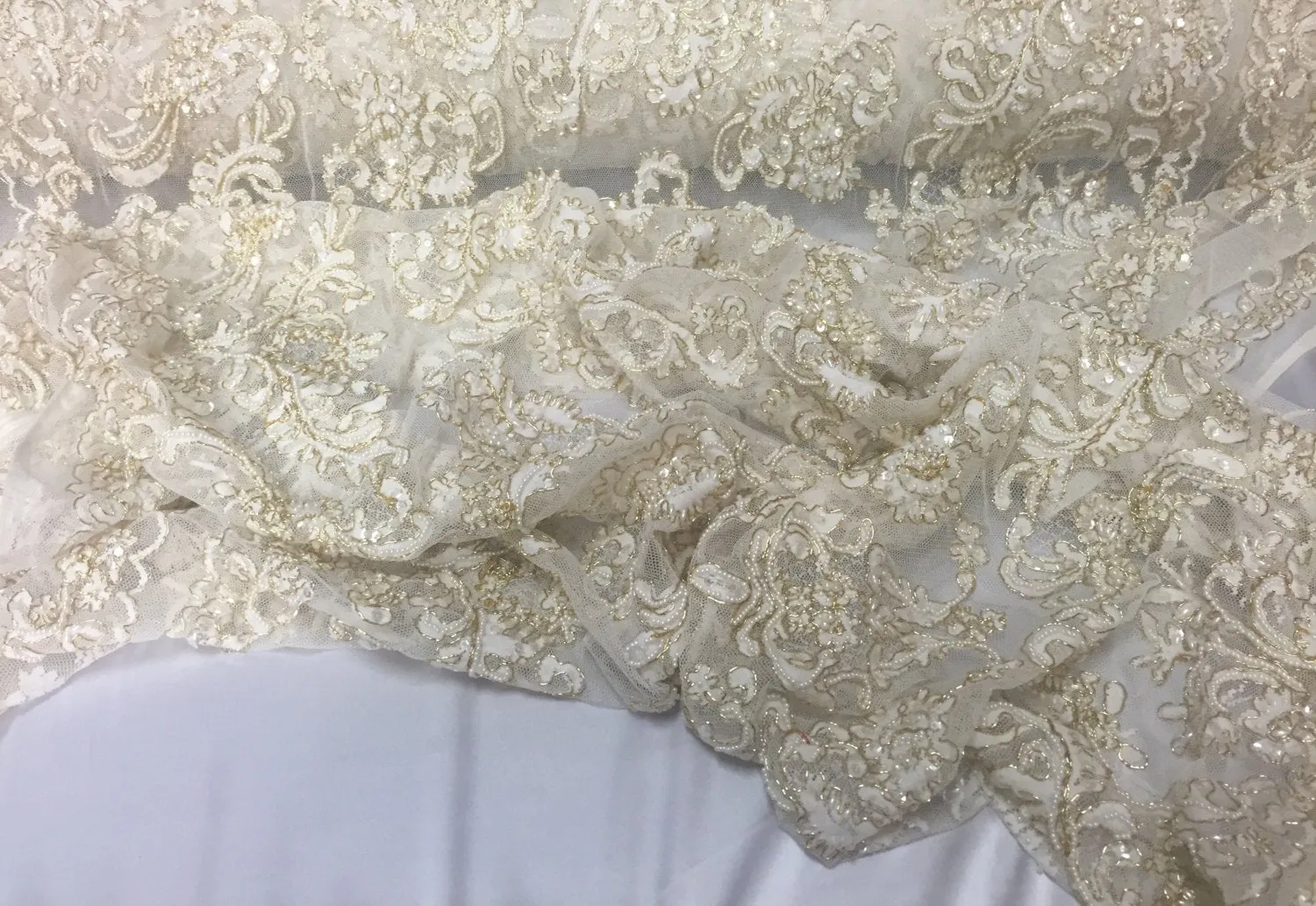 Ivory/metallic gold french design embroider and hand beaded with pearls ans sequins on a mesh lace-dresses-fashion-apparel-Sold by the yard.