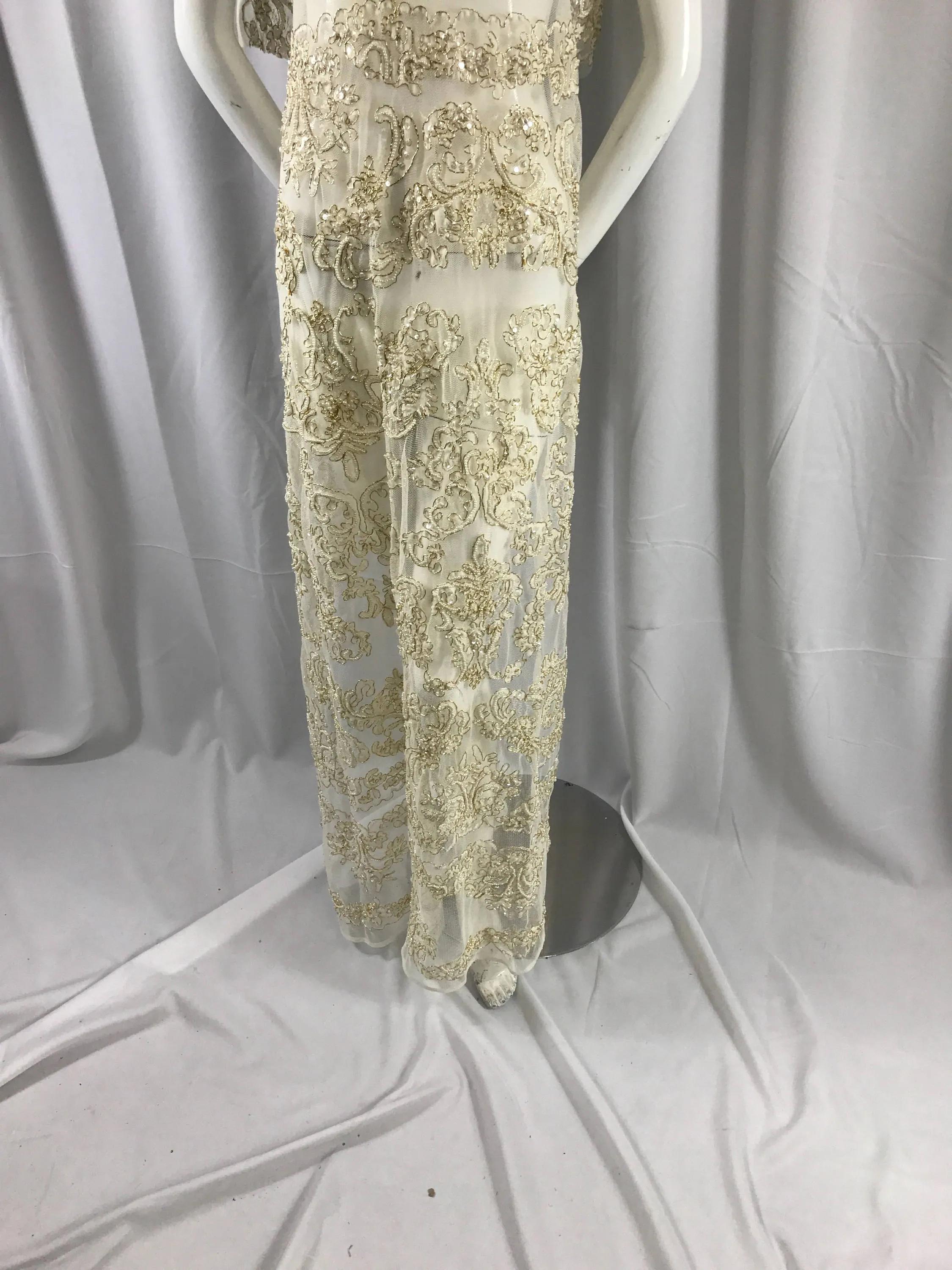 Ivory/metallic gold french design embroider and hand beaded with pearls ans sequins on a mesh lace-dresses-fashion-apparel-Sold by the yard.