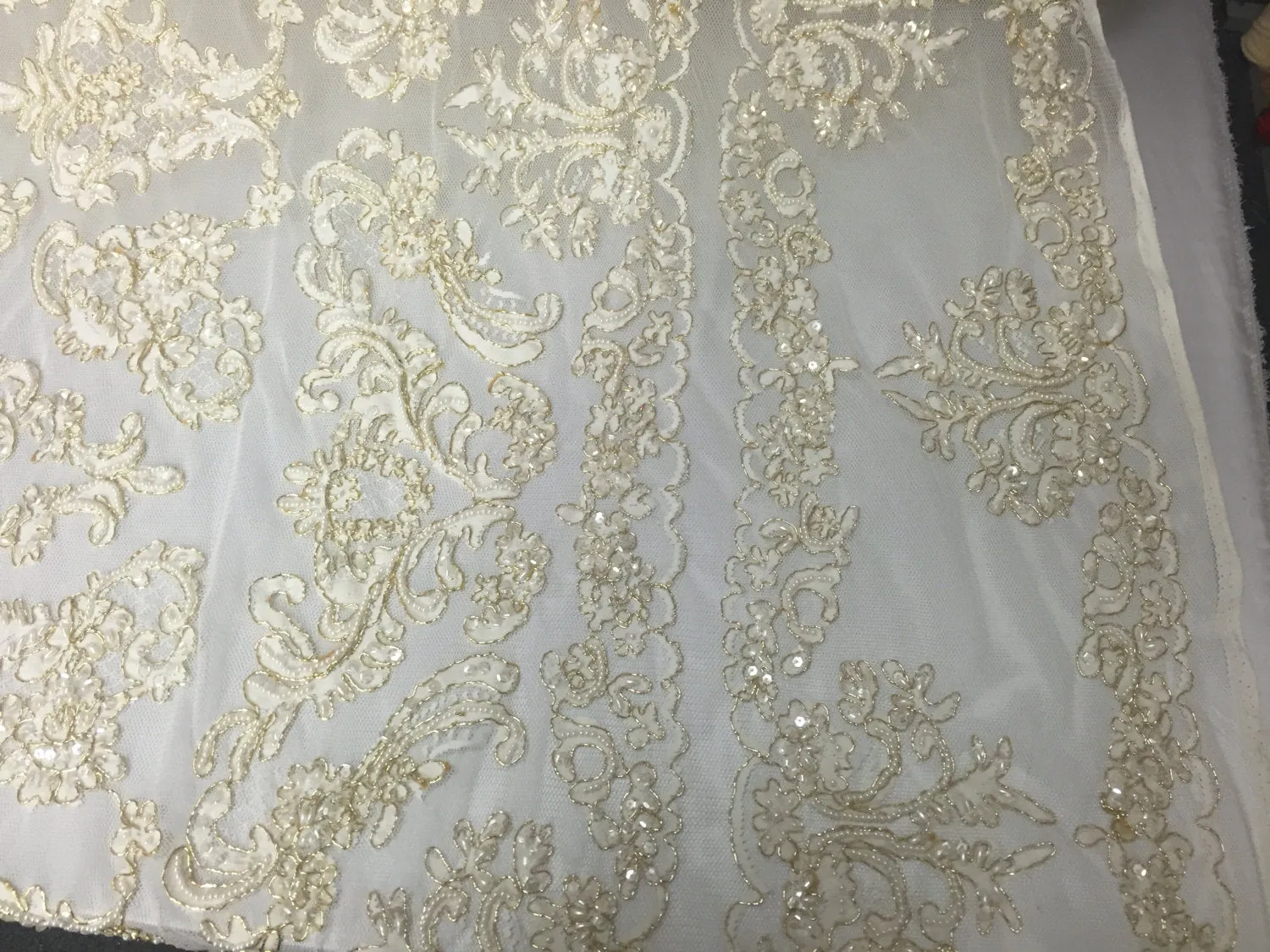 Ivory/metallic gold french design embroider and hand beaded with pearls ans sequins on a mesh lace-dresses-fashion-apparel-Sold by the yard.